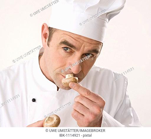 Cook smelling a mushroom