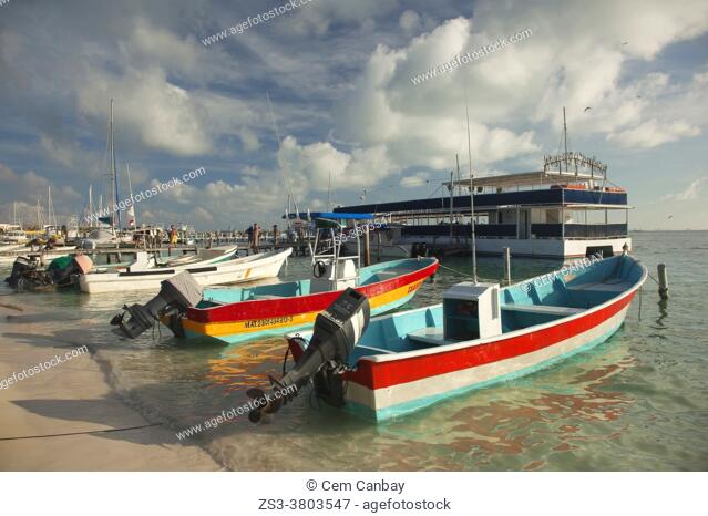Traditional fishing boats near the pier at the town center, Isla Mujeres, Cancun, Quintana Roo, Mexico, Central America
