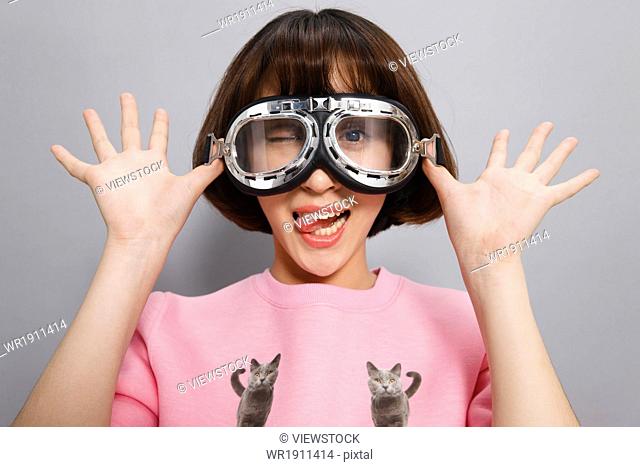Young woman wearing protective goggles