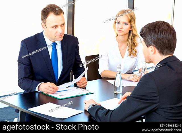 Group of business people discussing with analyzing data financial reports at the office desk
