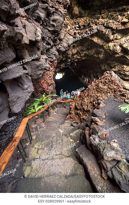 Unidentifiable Tourist visiting famous cave Los Jameos del Agua in Lanzarote, Canary islands, Spain