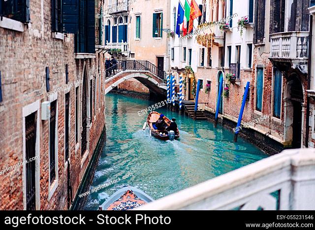 Picturesque view of Gondolas on lateral narrow Canal, Venice, Italy