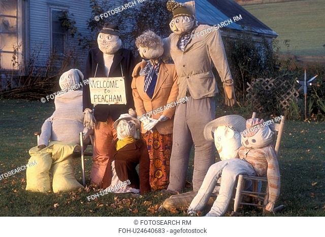 scarecrow, fall decorations, display, decoration, autumn, A fall decoration of a family of scarecrows on a lawn with a Welcome to Peacham sign in Peacham in...