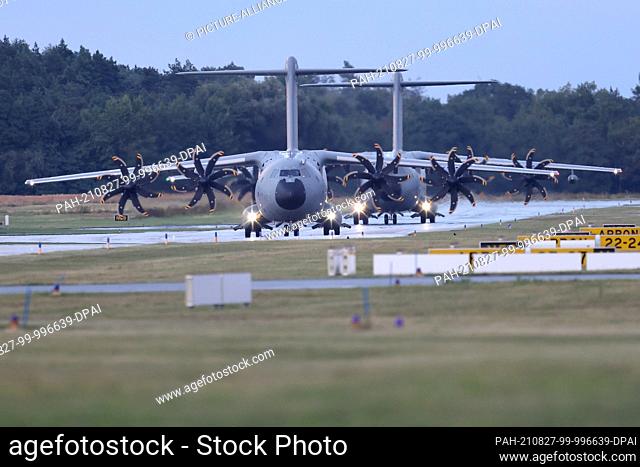 27 August 2021, Lower Saxony, Wunstorf: The two Bundeswehr A400M transport aircraft drive off after landing at the Wunstorf base in Lower Saxony