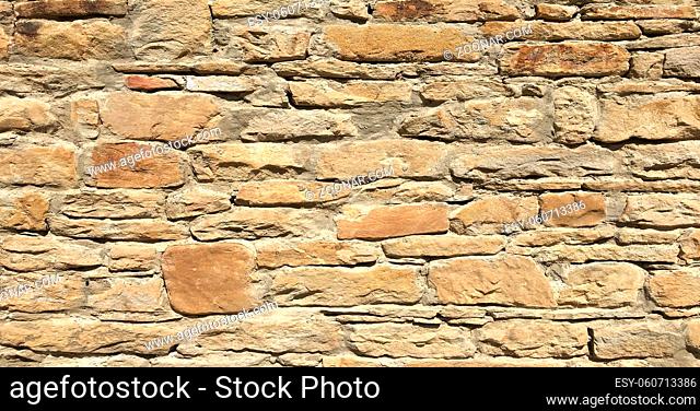 Stacked stone wall background horizontal. White stone tile texture brick wall