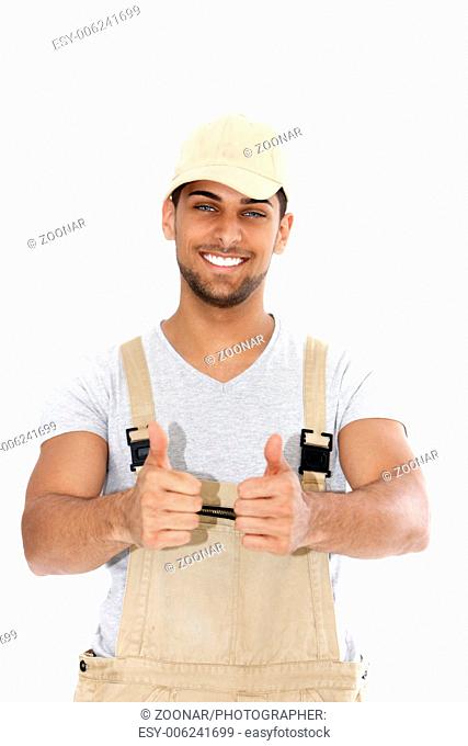 Handsome handyman giving a thumbs up