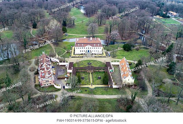 14 March 2019, Brandenburg, Branitz: The Schgloss (M) and outbuilding in the Fürst-Pückler-Park near Cottbus (aerial view with a drone)