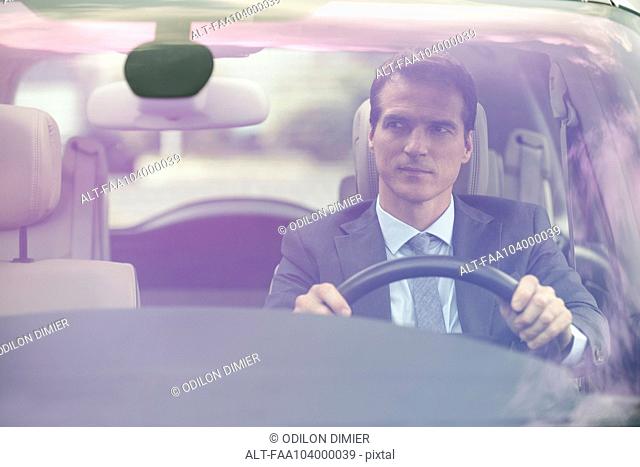 Man driving car without passengers