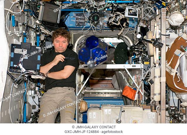 NASA astronaut Michael Barratt, Expedition 20 flight engineer, does a check of the Synchronized Position Hold, Engage, Reorient