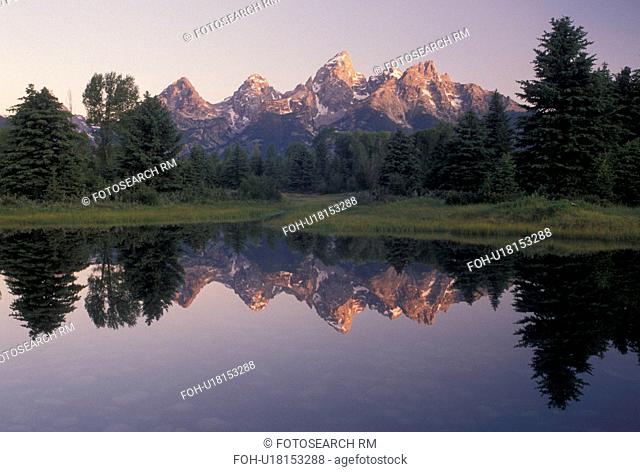 Grand Teton National Park, Snake River, Jackson Hole, WY, Wyoming, Scenic view of the Grand Teton Mountains reflecting in the calm waters of the Snake River at...