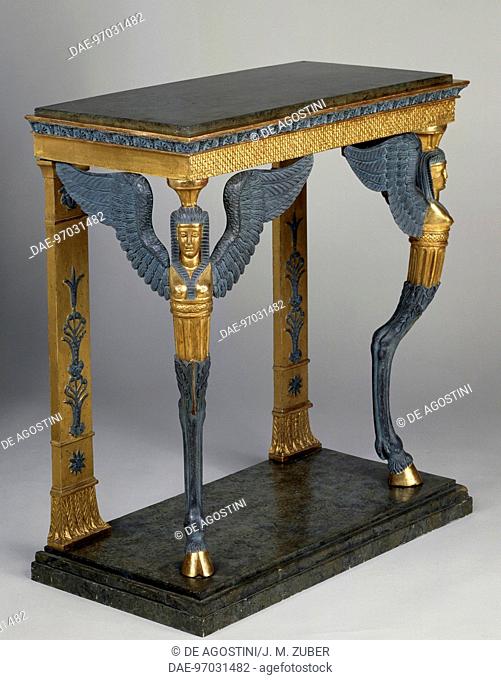 Rectangular Empire style console table in carved, gilt and gray-blue painted wood with green marble top and winged sphinx-shaped supports, ca 1810