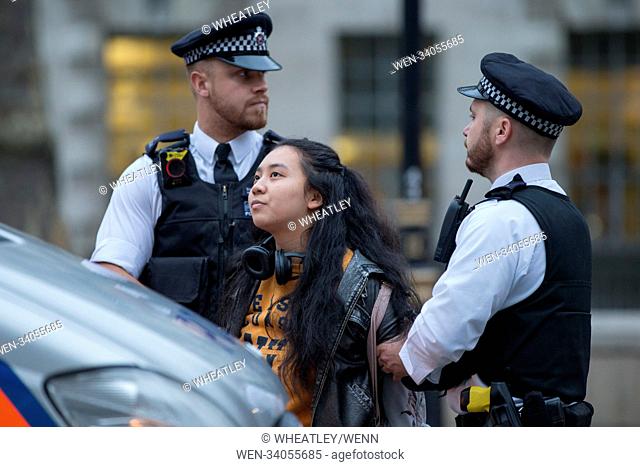 Protester arrests at Stop The War Coalition demonstration against armed intervention by the UK in the Syrian conflict opposite Downing street