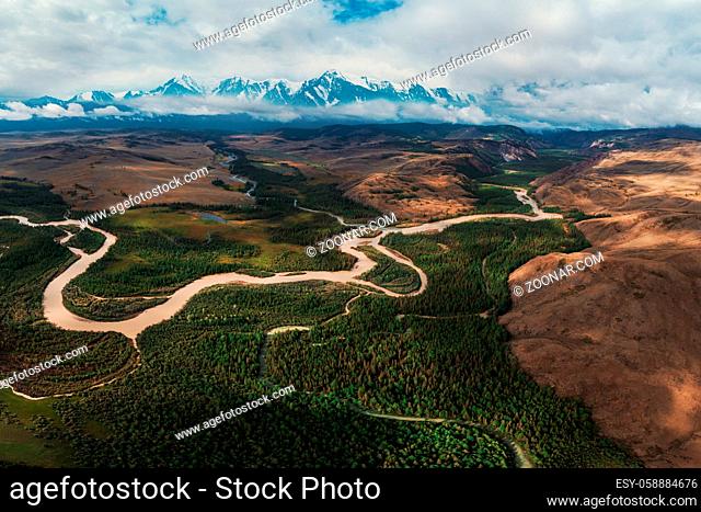 Aerial drone panoramic picture of Kurai steppe and Chuya river on North-Chui ridge background. Altai mountains, Russia