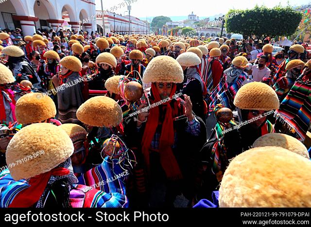 20 January 2022, Mexico, Chiapa de Corzo: Dancers called parachicos and chiapanecas parade through the streets of Chiapa de Corzo