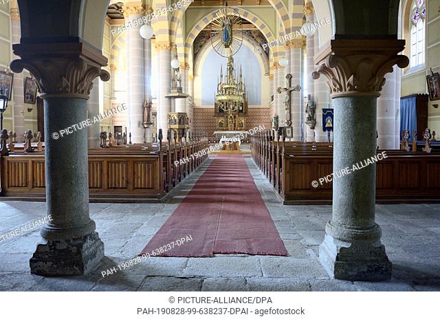 08 August 2019, Jachymov: Panoramic view into the town church St. Joachim and St. Anna, which is enthroned above the Czech spa and mining town Jachymov (Sankt...