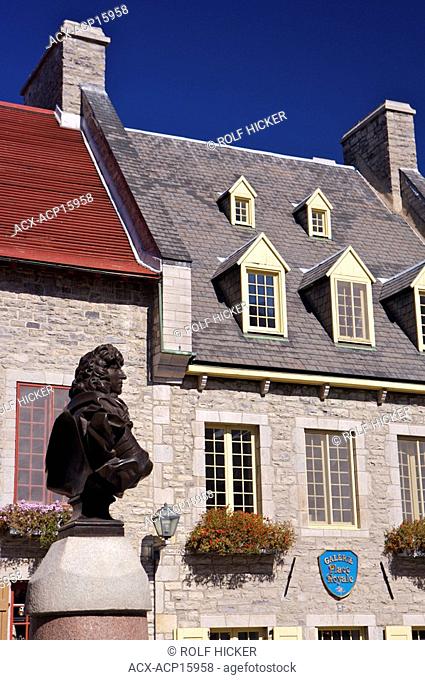 Old stone buildings and statue of Lovis XIV in Place-Royale in Old Quebec, Quebec City, Quebec, Canada. UNESCO World Heritage Site