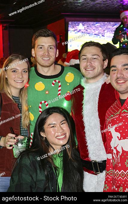 East Village, New York, USA, December 11th, 2021 - Several thousand Santas roamed the streets of the East Village in New York City celebrating Santacon 2021