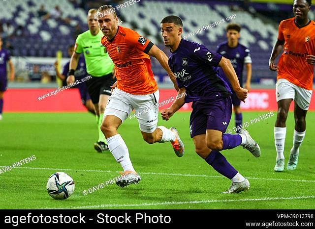 RSCA Futures' Simion Michez and Deinze's Dylan De Belder fight for the ball  during a soccer match between RSC Anderlecht Futures and KMSK Deinze,  Sunday 14 August 2022 in Anderlecht, on day
