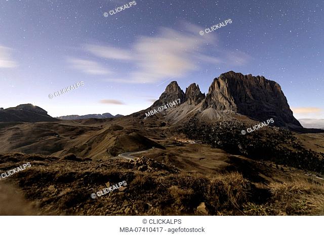 Starry sky on rocky peaks of Sassolungo, Sella Pass, Dolomites, South Tyrol, Bolzano province, Italy