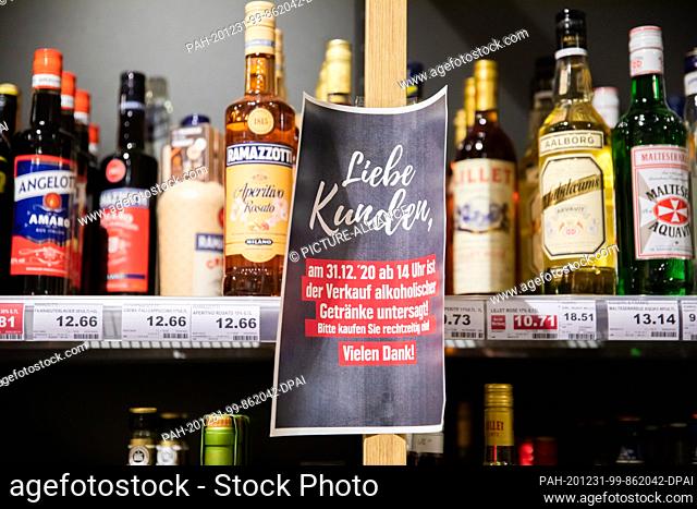 31 December 2020, Berlin: A sign hangs on a shelf in the beverage department of a supermarket in Berlin-Schöneberg shortly before the start of the ban on the...