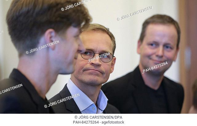 Klaus Lederer (l-r), the leading candidate of the Left Party, Berlin's mayor Michael Mueller (SPD) and the Green Party State Chairman Daniel Wesener give...