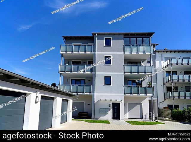 Germany, Bavaria, Upper Bavaria, Altötting district, residential complex, balconies with frosted glass panes, garages, flat roof, entrance area, pavement