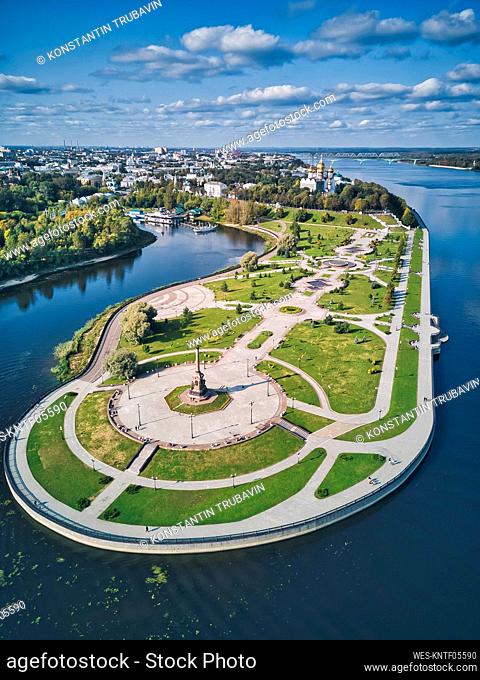 Park near city with Volga River and Kotorosl River against sky on sunny day