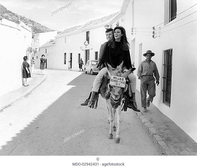American actress Raquel Welch (Jo Raquel Tejada) riding a donkey taxi with her boyfriend, the American film producer Patrick Curtis
