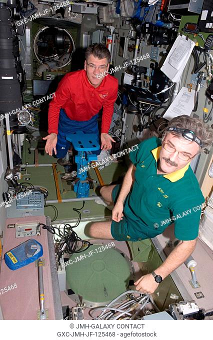 European Space Agency astronaut Paolo Nespoli (background) and Russian cosmonaut Alexander Kaleri, both Expedition 26 flight engineers
