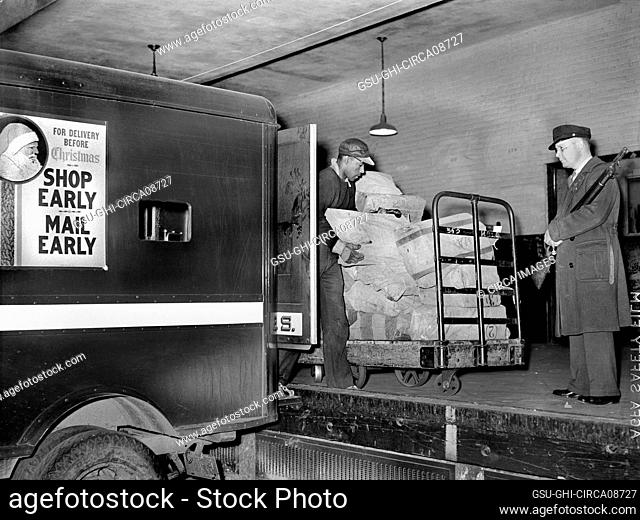 Workers on loading platform putting mail on Trucks, Main Post Office, Washington, D.C., USA, Arthur Rothstein, U.S. Office of War Information, 1938