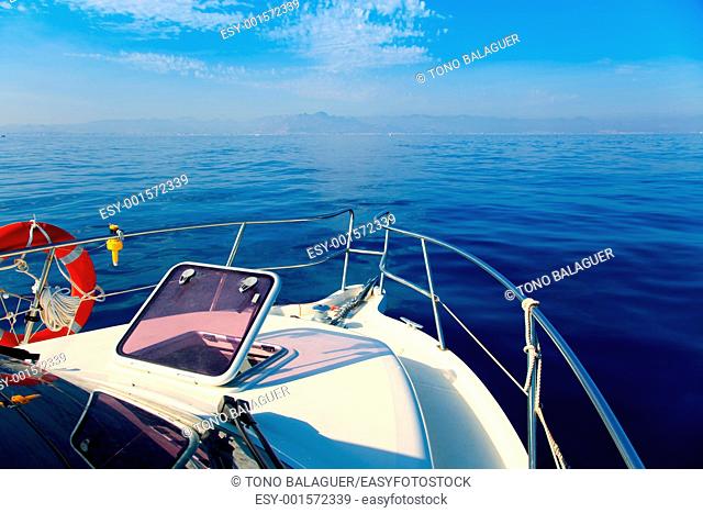 Blue sea boat sailing with open bow porthole in summer vacations