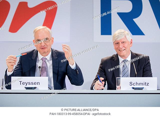 13 March 2018, Germany, Essen: Rolf Martin Schmitz (R), chairman of the board of RWE, and Johannes Teyssen, chairman of the board of E