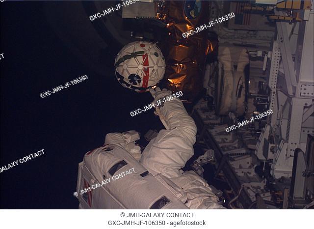 This Electronic Still Camera (ESC) view shows astronaut Winston E. Scott, mission specialist, during his second Extravehicular Activity (EVA) in the cargo bay...