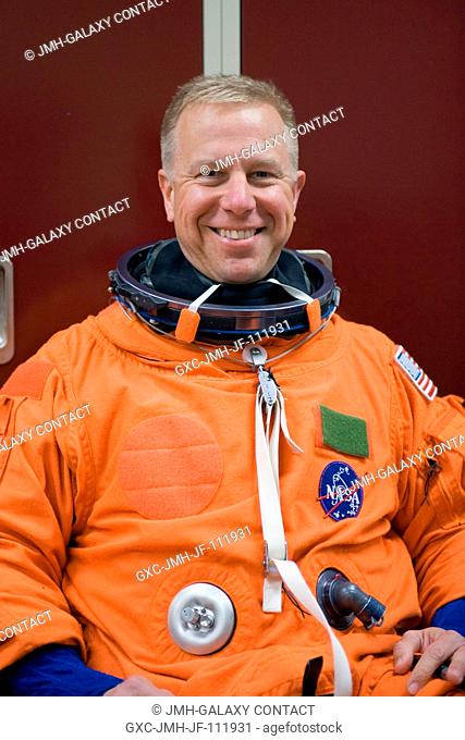 NASA astronaut Tim Kopra, STS-133 mission specialist, attired in a training version of his shuttle launch and entry suit