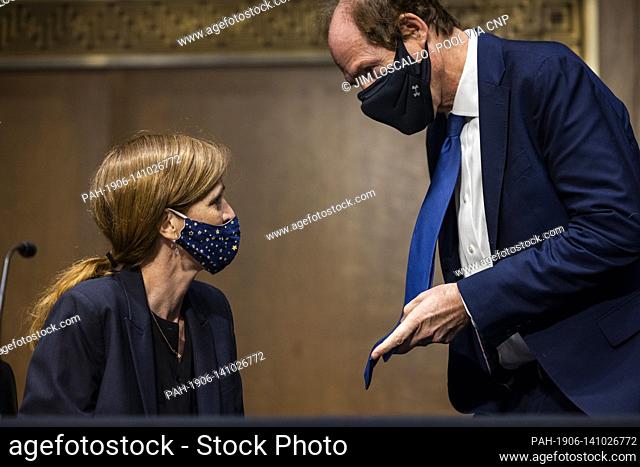 Former US Ambassador to the United Nations Samantha Power (L) chats with her husband, Cass Sunstein (R), prior to testifying before the Senate Foreign Relations...