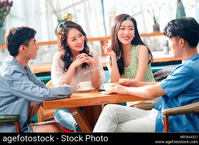Young friends drink coffee chat