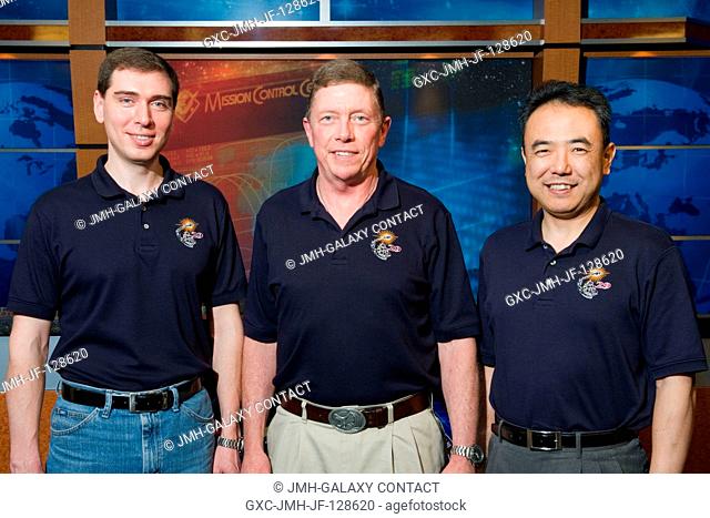 NASA astronaut Mike Fossum (center), Expedition 28 flight engineer and Expedition 29 commander; along with Russian cosmonaut Sergei Volkov (left) and Japan...
