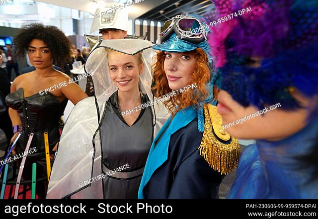 06 June 2023, Hamburg: Models wear clothing made of fabrics that are also used in cabins at the Lufthansa Technik stand at the Aircraft Interiors Expo (AIX) in...