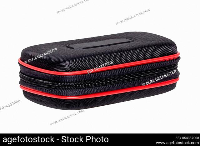 Closeup of a black stable hard bag for an industrial knife for cutting carpets and flooring and accessories isolated on a white background