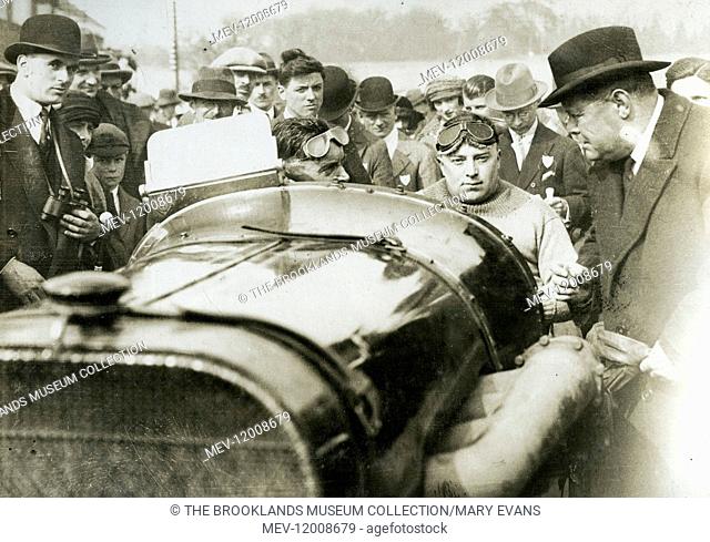 Sir Eric Geddes chairman of Dunlop inspecting Peugeot - Malcolm Campbell in car surrounded by crowds