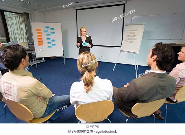 Training-area, seminar, course-participants, lecturer, explanation, series, people, area, women, men, employees, listening, interest, reciting, seminar-leader