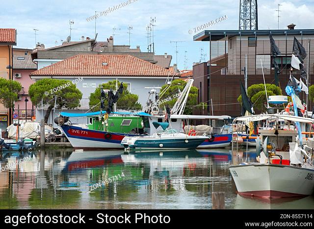 ITALY, Caorle - JULY 11, 2014: Tourist boat in the port of Caorle