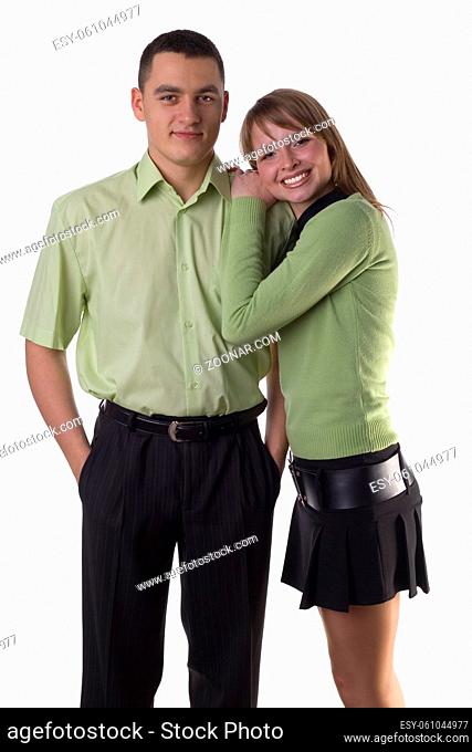 Young woman nestle her boyfriend's shoulder. Isolated on white in studio
