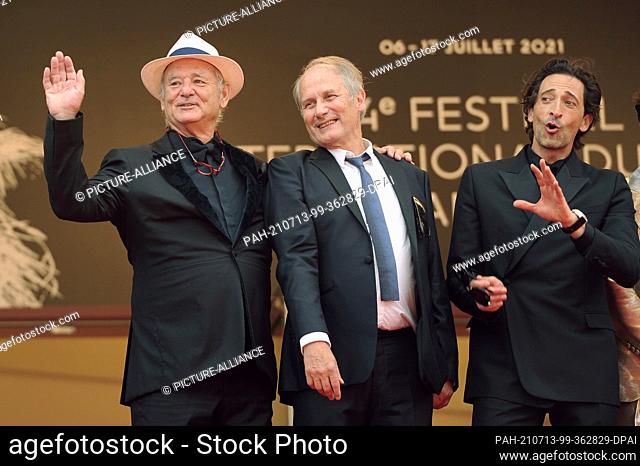 12 July 2021, France, Cannes: Bill Murray (l-r) , Hippolyte Giradot and Adrien Brody attend the screening of the film ""The French Dispatch"" during the 74th...