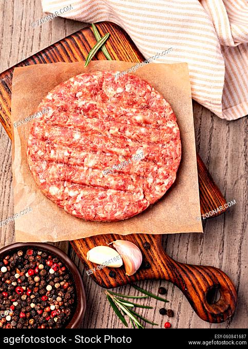 Raw Ground beef meat Burger steak cutlets on wooden background