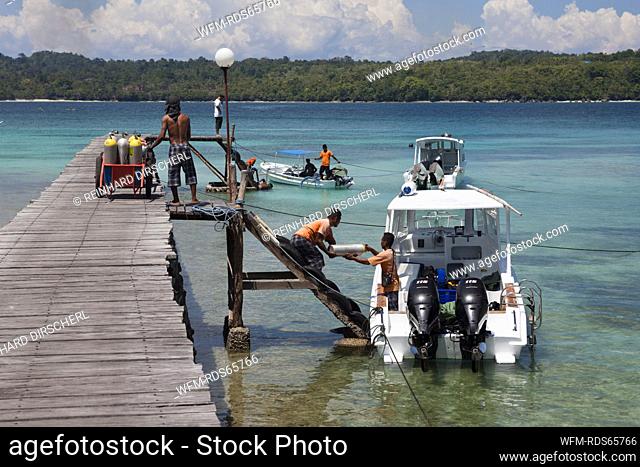 Loading Scuba Tanks on Diving Boat, Ambon, Moluccas, Indonesia