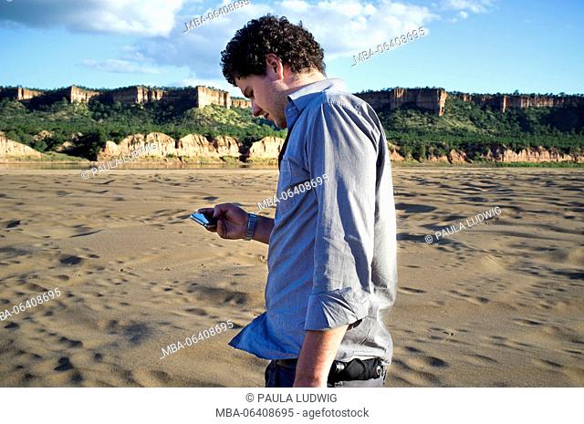 Man watching pictures on the mobile phone