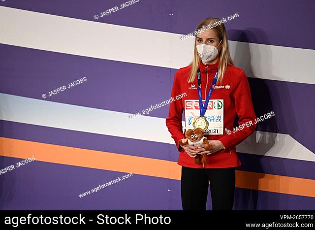Belgium's Elise Vanderelst celebrates on the podium after winning the women 1500m race at the European Athletics Indoor Championships, in Torun, Poland