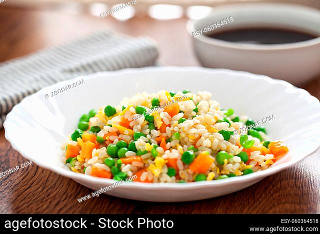 Oriental cantonese rice. Basmati rice with green peas, eggs and carrots