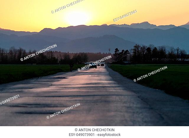 evening road heading to beautiful sunset horizon copyspace